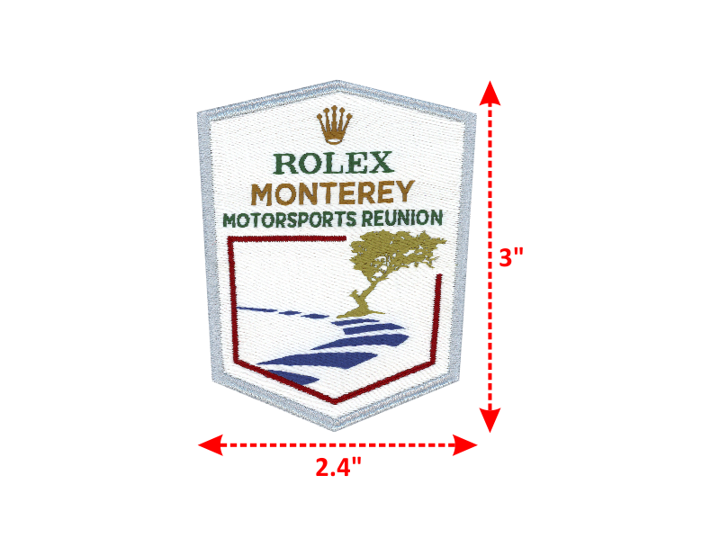 Multi color Woven With Stylized Font having lines underneath the text and crisp crown Rolex Monterey Motorsports Reunion Motorsports
